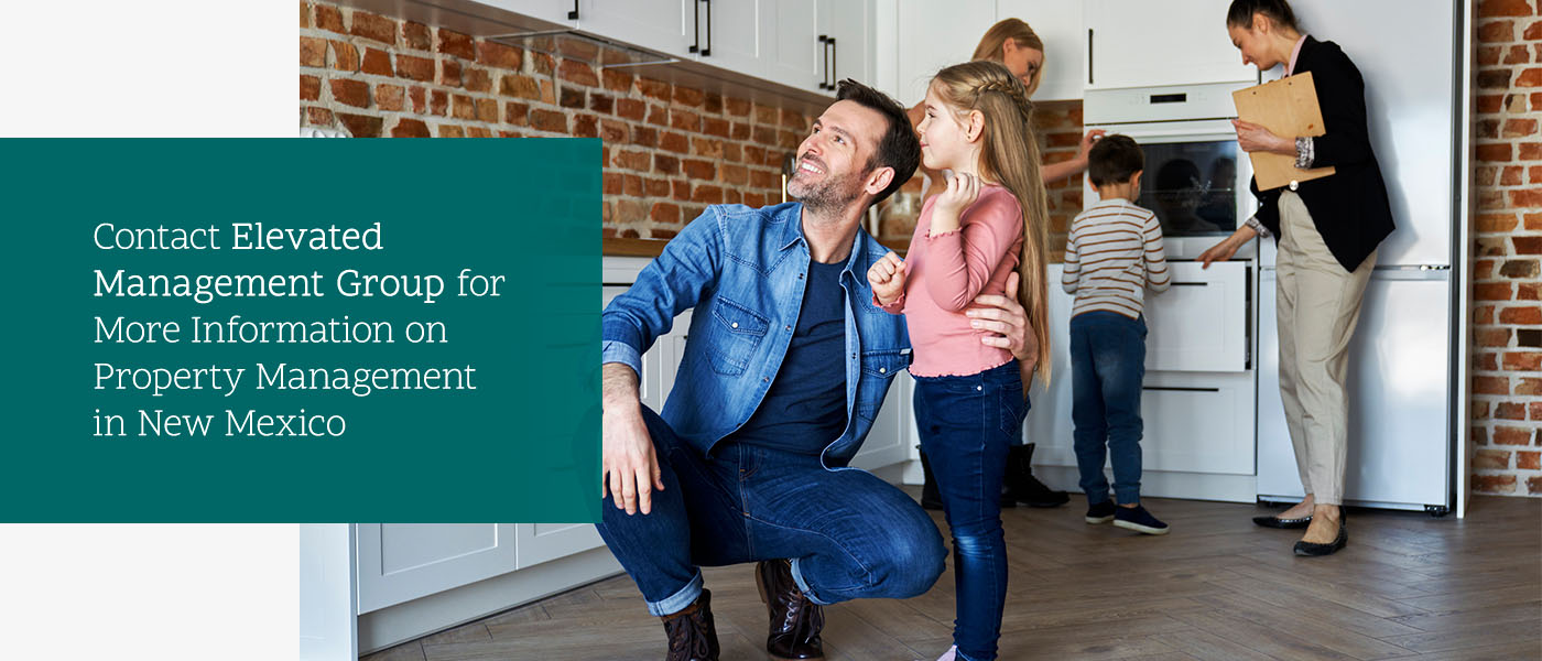 A family of four with their property manager exploring their new kitchen